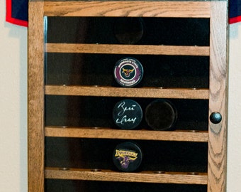 Hockey puck display cabinet  20 ,25,30or 35 pucks solid oak with door