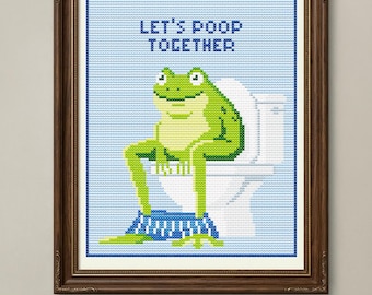 May include: Cross-stitch art framed in a dark brown wooden frame. The artwork features a green frog sitting on a white toilet with the text "LET'S POOP TOGETHER" above. The artwork measures 5.79 x 7.14 inches.