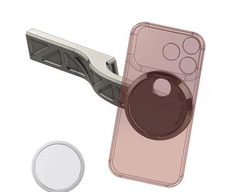 May include: A light gray, angular, truss-style mounting arm attached to a translucent pink smartphone case with a circular magnetic charging area. The text "MagSafe 15W" is visible on the case. A separate white circular charger is shown below.