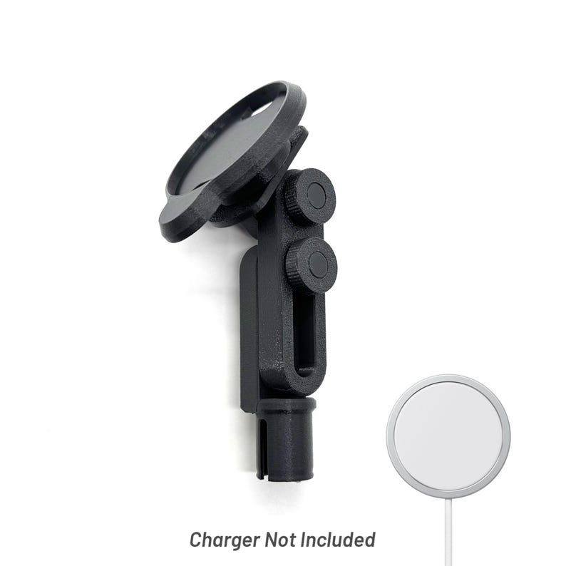 May include: A black phone mount with a circular top and adjustable arm. The mount has two circular adjustment knobs and a cylindrical base. The text "Charger Not Included" is at the bottom of the image.
