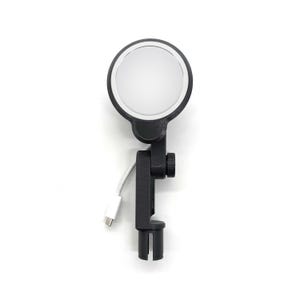 May include: A black LED ring light with a white circular light and a black adjustable clamp. The light has a white USB-C cable attached. The ring light is designed for use with a phone or camera.