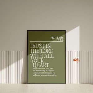 May include: A framed print with the text "TRUST IN THE LORD WITH ALL YOUR HEART" in white on a green background. The print also includes the text "PROVERBS 3:5-6" and the logo "The FD". The frame is black.
