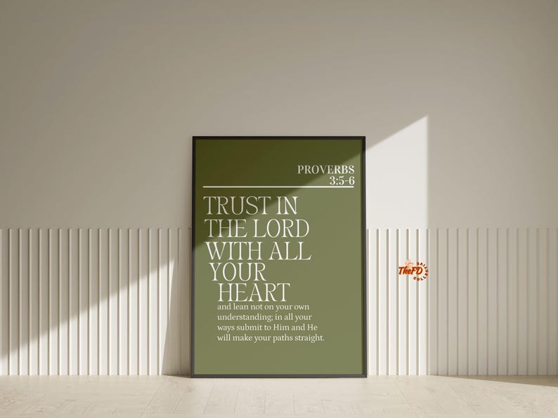 May include: A framed print with the text "TRUST IN THE LORD WITH ALL YOUR HEART" in white on a green background. The print also includes the text "PROVERBS 3:5-6" and the logo "The FD". The frame is black.