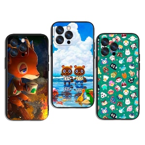 May include: Three phone cases with vibrant designs. One case depicts a deer character with a mug, another shows two bear-like characters on a beach, and the third has cartoon faces on a green background.