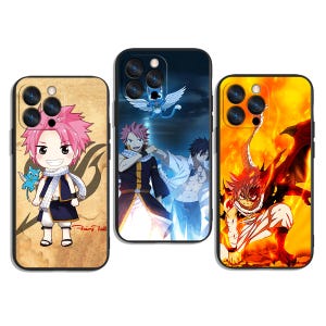 May include: Three phone cases featuring anime characters. The case on the left has a cartoon character with pink hair and a scarf. The middle case has a group of characters with a blue background. The case on the right has a character with red hair and a fiery background.
