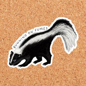 May include: A die-cut sticker featuring a black and white illustration of a skunk with a large, bushy tail. The skunk is depicted in profile, facing left, with the text RUNNING ON FUMES printed in black capital letters above its back.