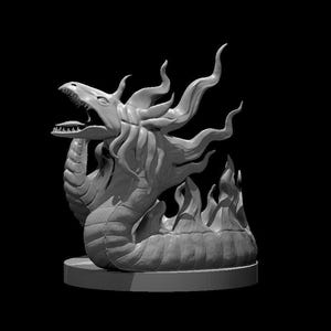 May include: A grey sculpture of a dragon-like creature with an open mouth and flame-like features. The detailed sculpture sits on a circular base, set against a black background.