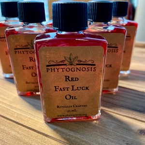 Red Fast Luck Oil - A Conjure oil for dressing candles, bills, and bags!