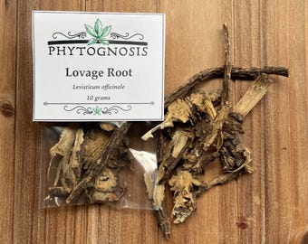 May include: A package of Lovage Root, Levisticum officinale, 10 grams, with the Phytognosis logo. The dried root pieces are brown and tan, displayed on a wooden surface.