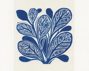 May include: A blue and white botanical print on a rectangular card. The print features stylized leaves with intricate patterns and details. The leaves are a deep blue against a white background, creating a striking contrast.