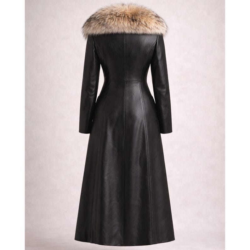 May include: A long, black leather coat with a fur collar. The coat has a fitted silhouette and a flared skirt. The fur collar is a mix of brown, tan, and cream colors. The coat is a classic style.