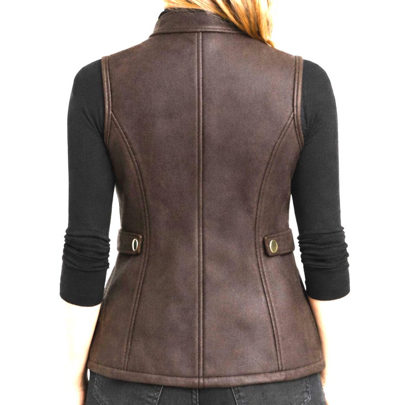 Back view of dark brown women’s leather vest on model, slim fit tailored panels, clean back seams, studio product lifestyle look, Anabia Leather Co.