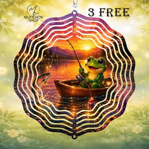 May include: A scalloped circular metal wind spinner featuring a colorful graphic of a green frog sitting in a wooden boat on a lake at sunset, holding a fishing rod with a fish jumping out of the water nearby. The text 3 FREE is visible.