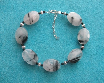 Tourmalinated quartz bracelet- oval faceted beads- adjustable