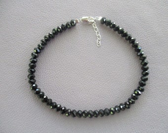 Black spinel bracelet- 4mm faceted beads- sterling silver lobster claw clasp- adjustable up to 8"