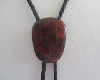 Dinosaur bone bolo tie- black braided cotton cord