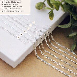 May include: Six sterling silver chain options labeled 1 through 6: 1.5mm classic chain, 1mm satellite chain, 1.5mm ball chain, 1.5mm box link chain, 2.3mm cable chain, and 2mm double rope chain, all displayed on a white surface.