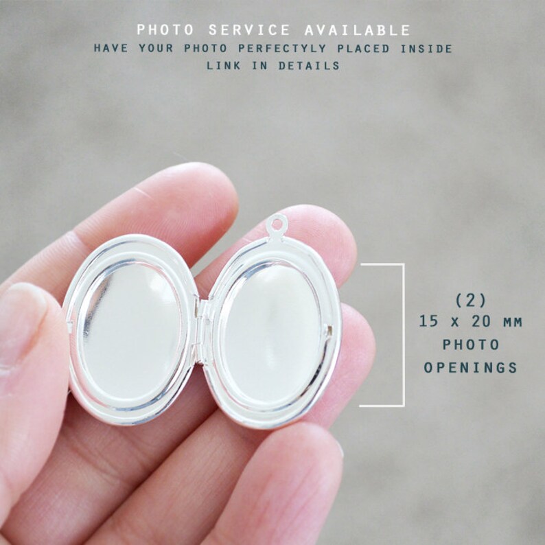 May include: A silver-toned oval locket with two interior compartments. The locket features two photo openings measuring 15 x 20 mm each. Text on the image reads: PHOTO SERVICE AVAILABLE, HAVE YOUR PHOTO PERFECTLY PLACED INSIDE, LINK IN DETAILS.