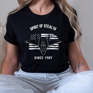 Unisex spirit of stealth jet t-shirt – military aircraft graphic tee, fighter plane USA flag shirt, tactical air force gift for him her