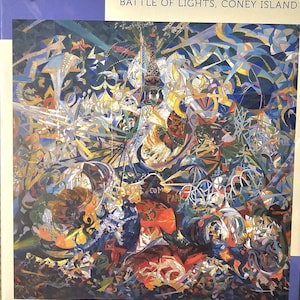 May include: A 1000-piece jigsaw puzzle featuring Joseph Stella's "Battle of Lights, Coney Island" artwork. The puzzle box has a blue border and displays the painting's vibrant colors and abstract shapes. The Pomegranate Artpiece Puzzle logo is visible.