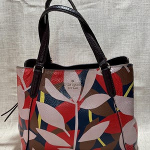 Shop Kate Spade Outlet Handbags for Over 75% Off kate spade Red and Purple Patterned Tote with Tan Handles display picture 1