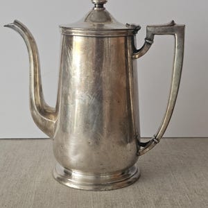 May include: A rustic wooden sign with the text "Welcome to our home" in white lettering. The sign features a distressed finish and a simple, inviting design, perfect for entryway decor.