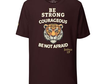 May include: A maroon t-shirt with a tiger illustration and the words "BE STRONG COURAGEOUS BE NOT AFRAID" and the Bible verse Joshua 1:9. The tiger has orange, black, and white stripes.