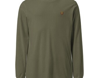 May include: Olive green long-sleeve shirt with a crew neck. A small, embroidered design in shades of red, yellow, and brown is on the left chest. The shirt has a classic, casual style, suitable for everyday wear.
