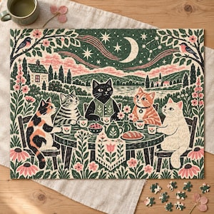 May include: A jigsaw puzzle featuring an illustration of five cats sitting at a round table in a garden setting. The scene includes a black cat, a tabby, a calico, an orange cat, and a white cat, all drinking tea under a starry night sky.