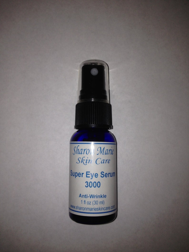 May include: A blue bottle of Sharon Marie Skin Care Super Eye Serum 3000, an anti-wrinkle serum. The bottle is 1 fl oz (30 ml) and the website is www.sharonmarieskincare.com.
