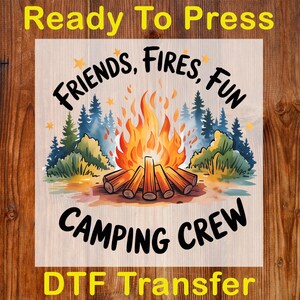 May include: A DTF transfer featuring a campfire scene with the words "FRIENDS, FIRES, FUN" and "CAMPING CREW". The design includes a vibrant orange and yellow campfire, surrounded by green and blue trees, and a light brown background.