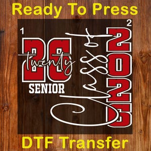 May include: A DTF transfer design with the text "Ready To Press" and "DTF Transfer" in yellow. The design features "2023" in red and white, with "Class of" and "Senior" in white script on a dark wood grain background.