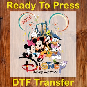 May include: DTF Transfer featuring Disney characters, including Mickey and Minnie Mouse, Goofy, Donald Duck, and Tinkerbell. The design includes the text "Disney Family Vacation" and the year "2026". The words "Ready To Press" and "DTF Transfer" are also included.