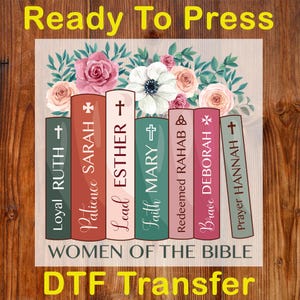 May include: A DTF transfer design featuring a stack of books with floral accents. Each book spine is a different color and has a name and a symbol. The text "WOMEN OF THE BIBLE" is at the bottom, with "Ready To Press" and "DTF Transfer" at the top and bottom.