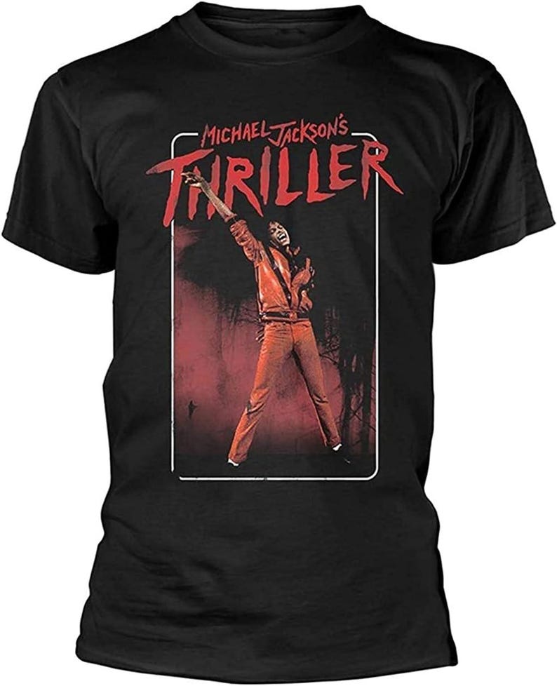 May include: Black t-shirt featuring a graphic of Michael Jackson from the Thriller music video. The image shows Jackson in a red outfit with the word "Thriller" in red text. The shirt is a classic crew neck style.