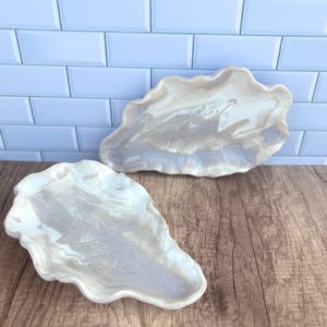 May include: A rustic wooden sign with the text "Welcome to our home" in white lettering. The sign features a distressed finish and a simple, inviting design, perfect for a front porch or entryway.