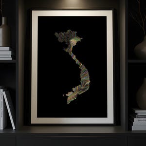 May include: Framed art print featuring a colorful, abstract representation of the Vietnam map against a black background. The artwork uses a flowing, linear design with a variety of colors. The print is displayed in a black frame with a white border.