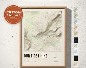 May include: A framed custom trail map print titled OUR FIRST HIKE, featuring a topographic map of Yosemite, California. The map displays a highlighted red trail, elevation markers, and a legend. Text includes names, date, and location details.