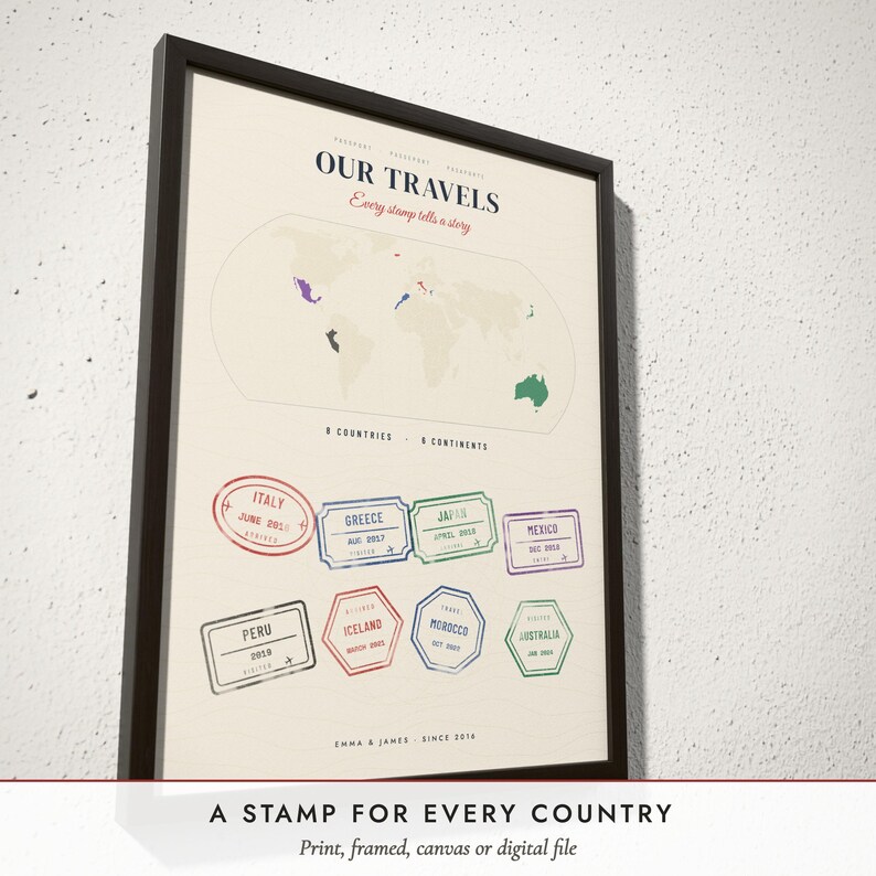 Three-quarter view of the framed Passport Stamp Map poster on a white plaster wall