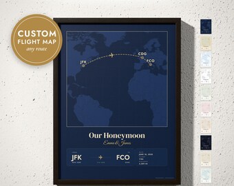 May include: A framed custom flight map print featuring a dark blue world map with a gold flight path connecting JFK, CDG, and FCO airports. The text reads Our Honeymoon, Emma & James, and includes flight details from JFK to FCO.