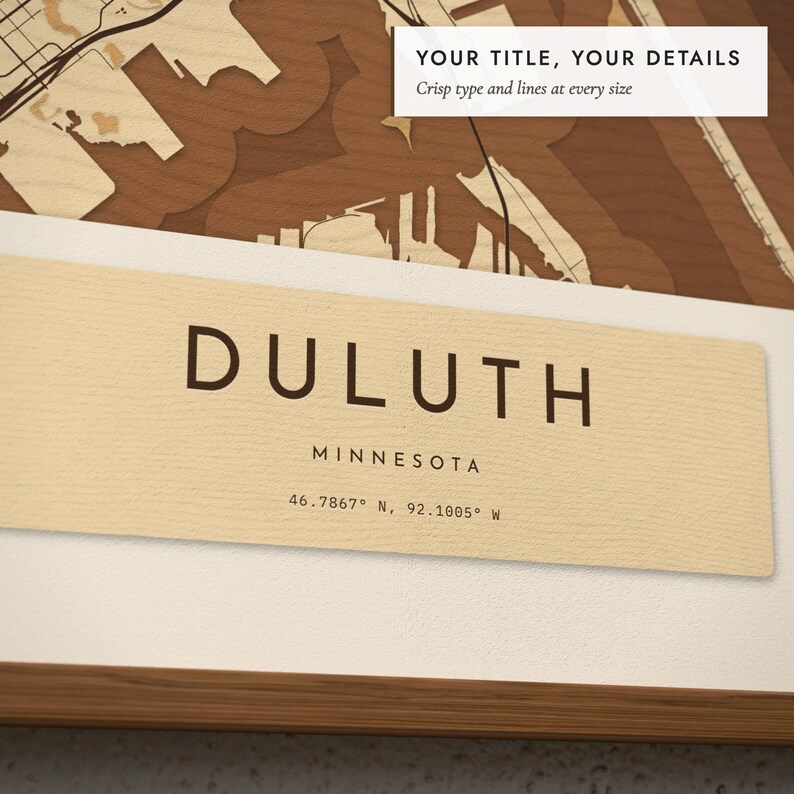 Close-up of the personalized title and details on the Layered Wood City Map print