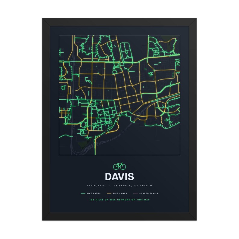 Real product photo: the Custom Bike Map Print in the black wood frame with a clear acrylic front