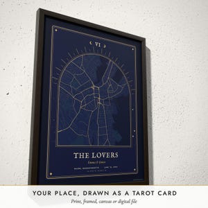 Three-quarter view of the framed Tarot Card Map poster on a white plaster wall