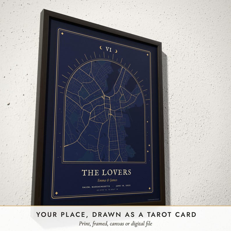Three-quarter view of the framed Tarot Card Map poster on a white plaster wall