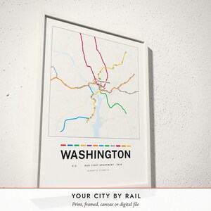 Three-quarter view of the framed Metro Line Map poster on a white plaster wall