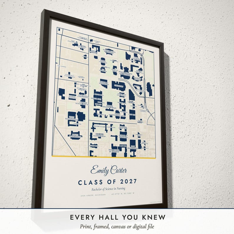 Three-quarter view of the framed Campus Map poster on a white plaster wall