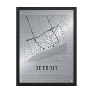 Real product photo: the Custom Etched Metal Look City Map Print in the black wood frame with a clear acrylic front
