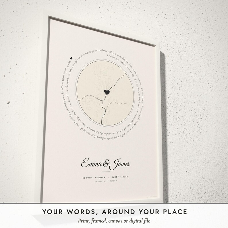 Three-quarter view of the framed Words & Map Print poster on a white plaster wall