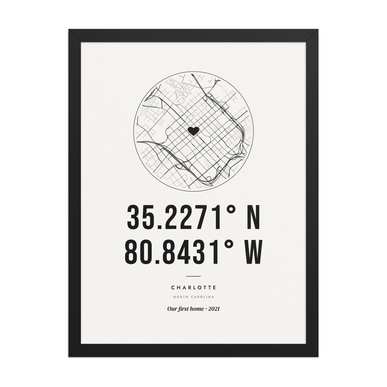 Real product photo: the Custom Coordinates Print in the black wood frame with a clear acrylic front