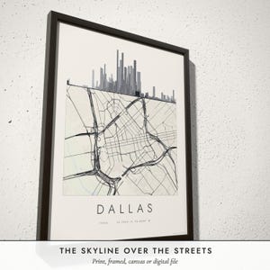 Three-quarter view of the framed Skyline & Street Map poster on a white plaster wall